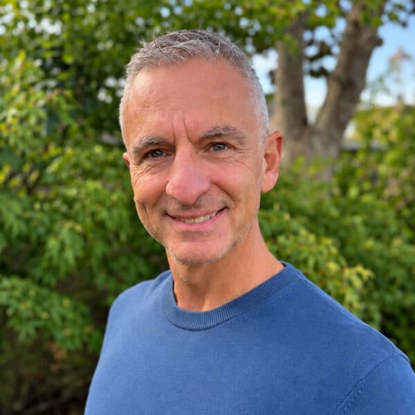 Paul Zanna, Technical Director at Create Consulting Engineers, outdoors with trees in background.