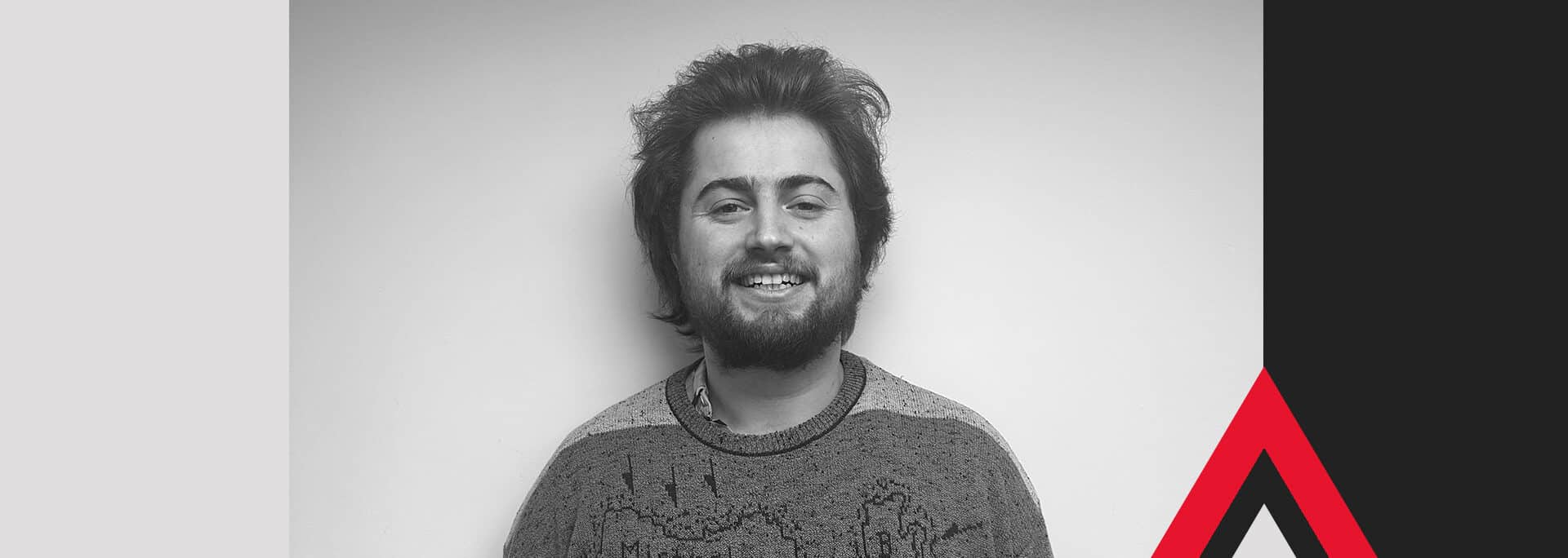 George Baker, promoted to Flood Risk Consultant at Create Consulting Engineers, smiling in professional headshot portrait.