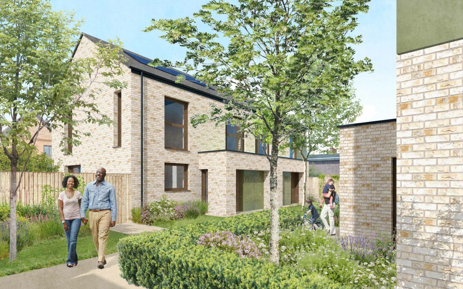 Modern brick residential development at Paget Road, Studio Partington entrance view, featuring contemporary architecture with landscaped communal gardens and mature trees.