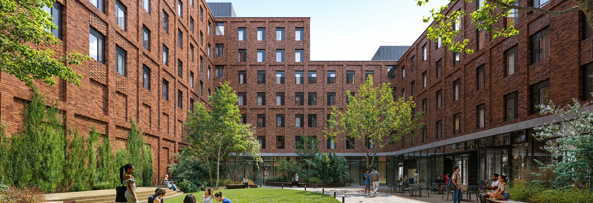 Cricklewood Broadway student scheme courtyard with brick buildings, green lawn, paved areas, and landscaping in London.