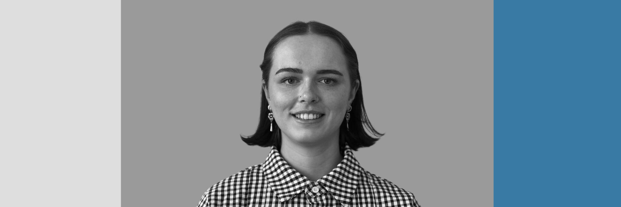 Professional headshot of Olivia Blythe, newest member of Create Consulting Engineers' Air Quality team, wearing a gingham shirt.